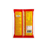 The back of a red and yellow package of dried pasta, showing nutritional information, ingredients, and a barcode on a plain white background.
