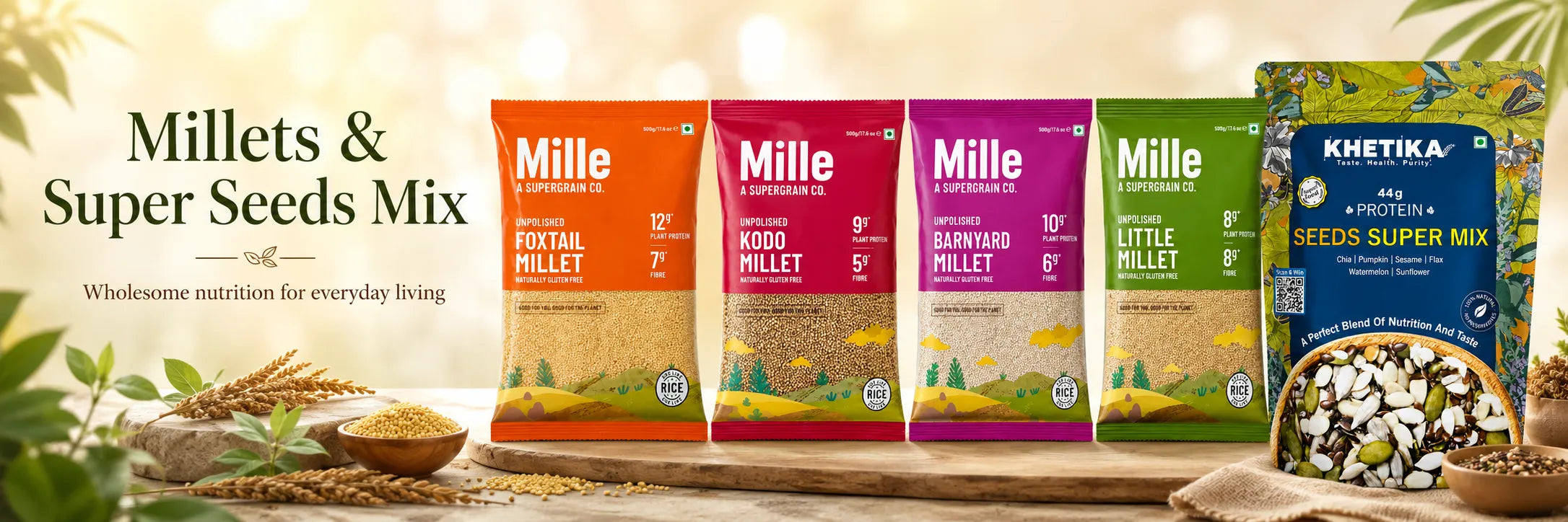 Four bags of Mille Millet products in orange, brown, dark brown, and green packaging, displayed alongside a blue bag of Khetika Seeds Super Mix on a wooden surface with grains and seeds.