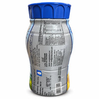 A plastic bottle of Eesav canarydailyfood.com plant-based milk shown from the back, featuring a blue ribbed cap and a silver label with black text and nutritional information.
