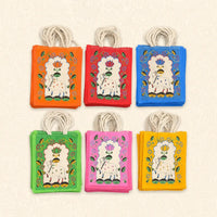 Printed jute return gift bags with rope handles in assorted colours for Varalakshmi Pooja and festive gifting