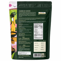 Back view of a 17.6 oz stand-up pouch of Palakku Organic Soaps Soapy Palm Oil Handmade Soap, featuring product information, a nutrition facts label, and colorful illustrations on a dark green background.